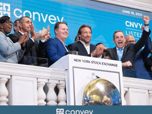 Steph and the executive team of Convey Health stood on the podium at the New York Stock Exchange to celebrate the company's IPO (CNVY), 2021