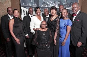 Steph and Morshee pictured with Steph’s parents and siblings at the Brothers on the Square Annual Black & White Scholarship Ball, 2022