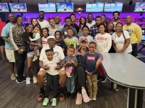 Steph with her family, including her host of nieces and nephews at the annual Collier Family bowling outing, Thanksgiving 2022